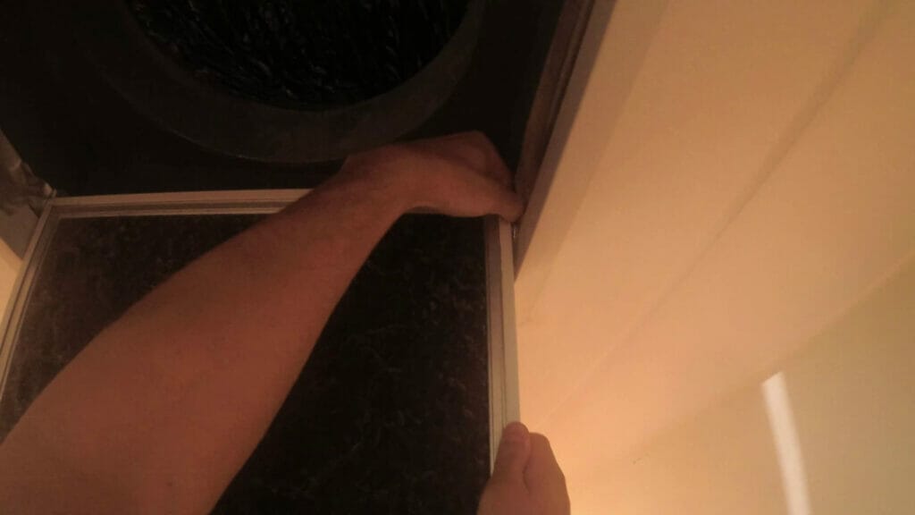 HOW TO REPLACE THE DUCTED AIR CONDITIONER FILTER remove filter panel from hingers 1