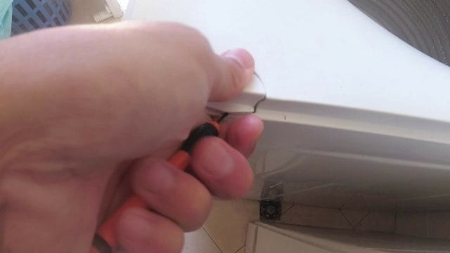 REPLACING THE SUSPENSION BANDS ON THE FISHER AND PAYKEL WASHING MACHINE covers open